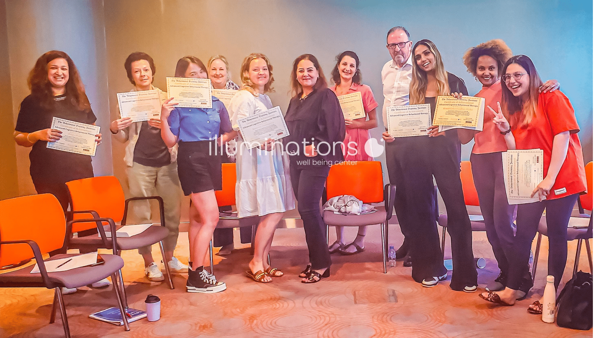 Diploma in Positive Psychology graduates holding their certificates at The Behaviour Institute